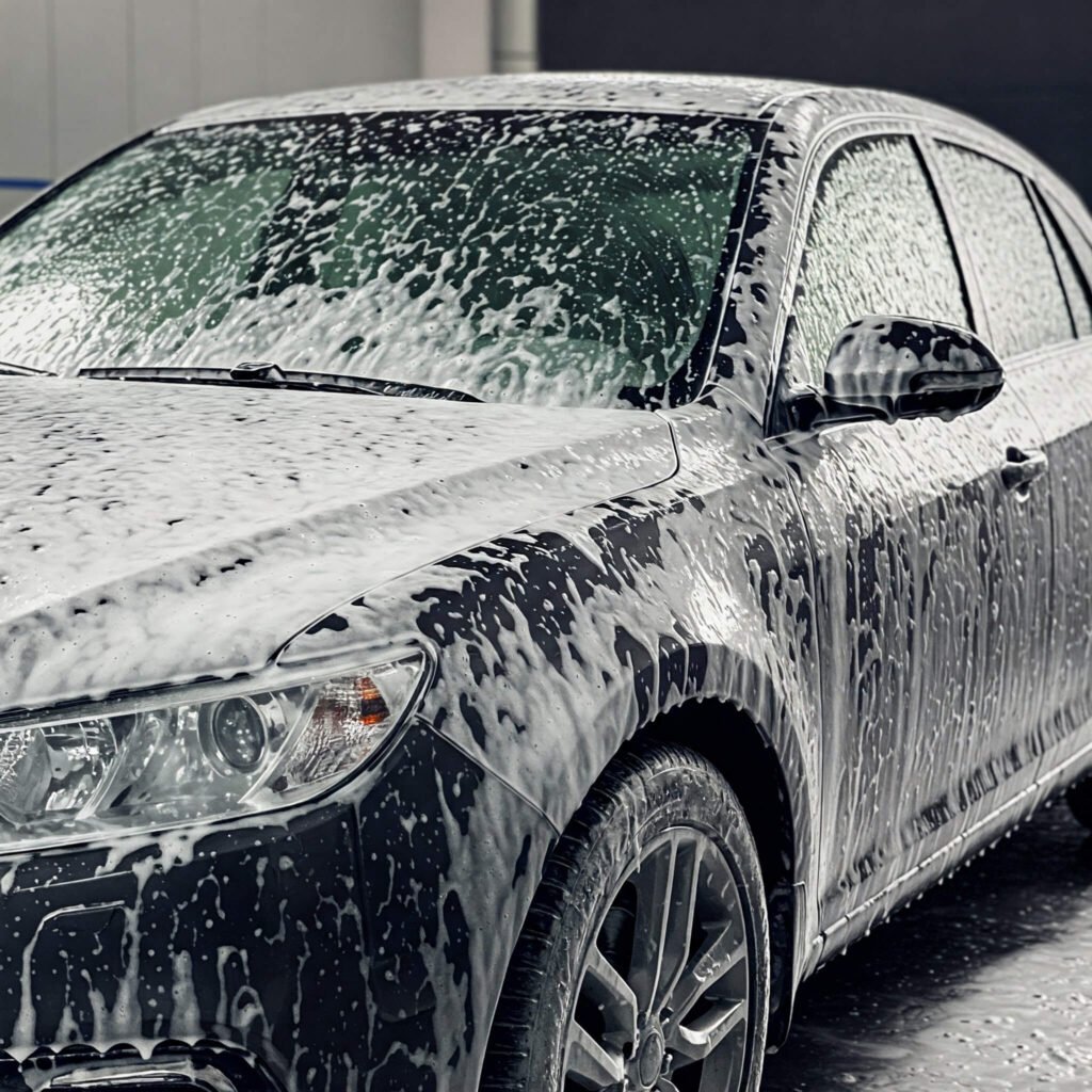 Foamy car pre-wash on driveway.