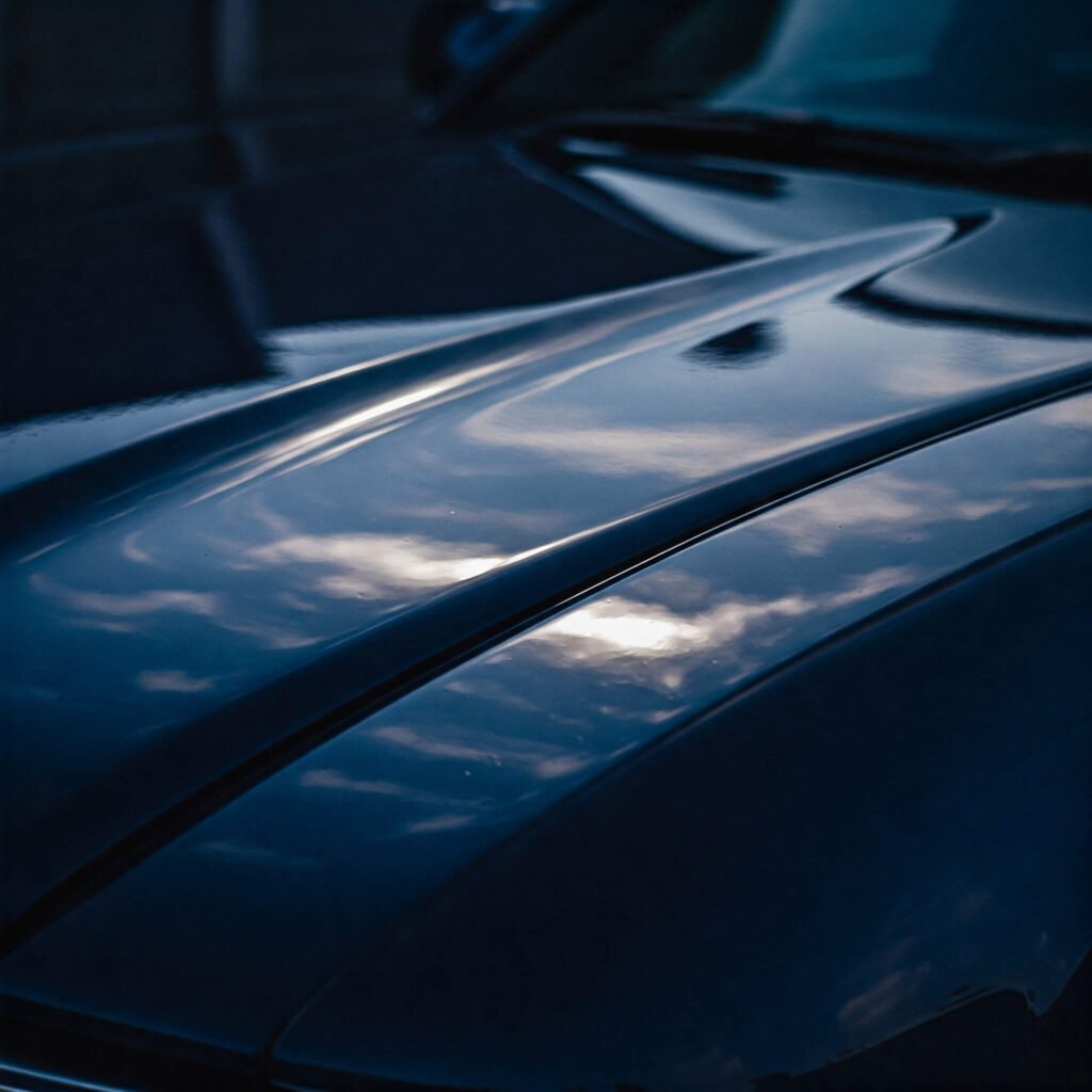 Polished car hood reflection.