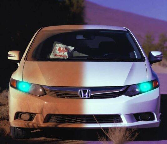 Step-by-Step Car Detailing Guide for a Showroom Shine Half-dirty 2012 Honda Civic at dusk, teal headlights glowing, tumbleweed photobombing.