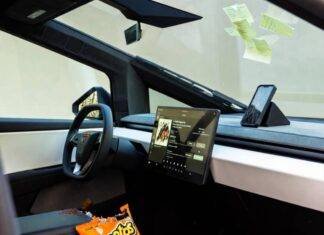 Best Electric Cars of 2025: Which One Fits Your Lifestyle? Messy Cybertruck interior: spilled Flamin’ Hot Cheetos, cracked phone streaming lo-fi, sticky notes.
