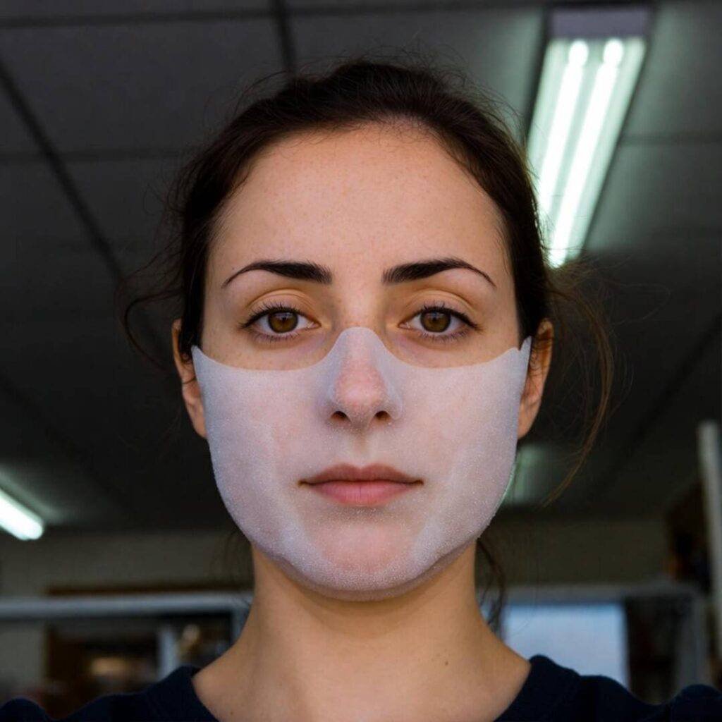 Selfie in foggy microfiber mask under LED shop lights.