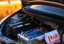 Lead-Acid vs. Lithium Car Batteries: What’s Right for You? Spilled acid dissolves "I Voted" sticker in chaotic Civic battery bay with lithium pack and Whataburger bag.