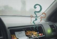 Hidden Car Insurance Coverage You Might Be Missing Crumpled insurance in messy car glovebox.