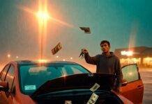 Used vs. Leased Cars: Which Saves You More? Confused guy in rainy Walmart lot holds two keys as cash spills from beat-up Civic's hood.