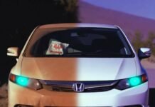 Step-by-Step Car Detailing Guide for a Showroom Shine Half-dirty 2012 Honda Civic at dusk, teal headlights glowing, tumbleweed photobombing.