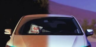 Step-by-Step Car Detailing Guide for a Showroom Shine Half-dirty 2012 Honda Civic at dusk, teal headlights glowing, tumbleweed photobombing.