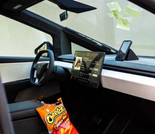 Best Electric Cars of 2025: Which One Fits Your Lifestyle? Messy Cybertruck interior: spilled Flamin’ Hot Cheetos, cracked phone streaming lo-fi, sticky notes.