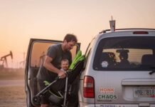 3-Row SUVs Ranked: Which One Is Best for You? Dad wrestling stroller into minivan at sunset.